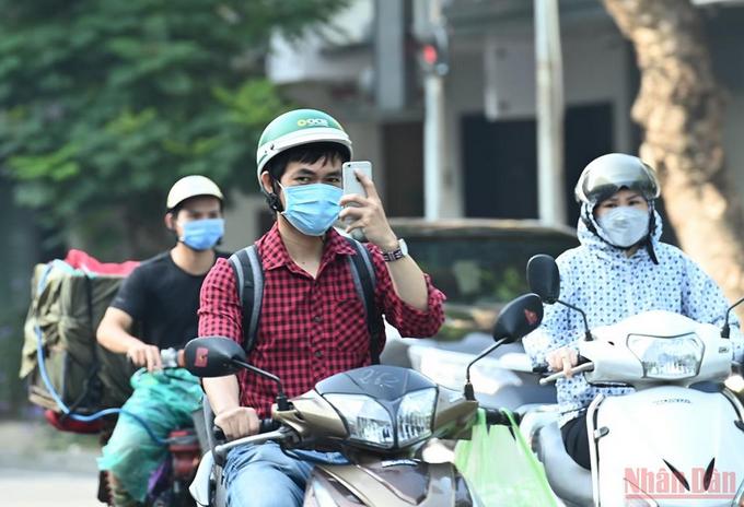 Hanoi bustles again as social distancing restrictions eased