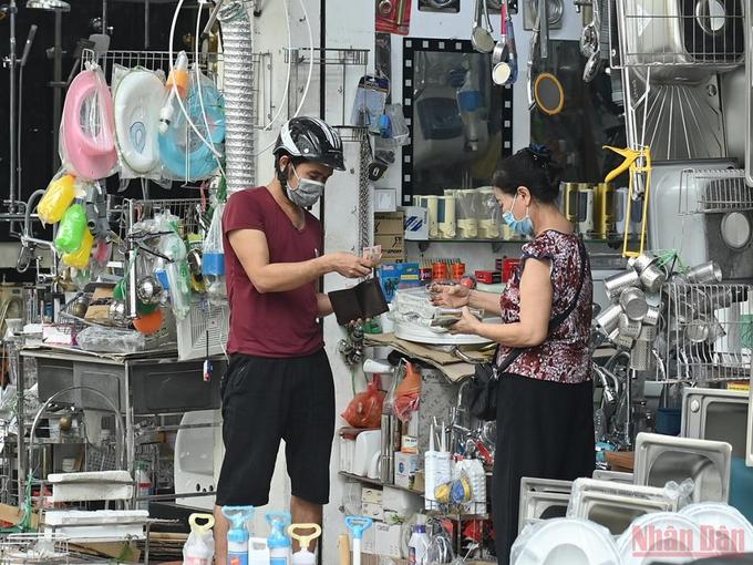 Hanoi bustles again as social distancing restrictions eased